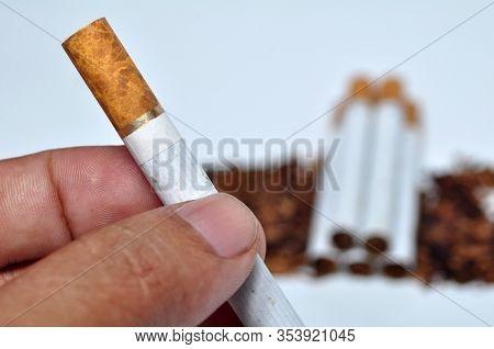 Holding Of Cigarettes With Hand White Background
