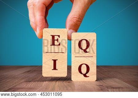 Emotional Intelligence Versus Logical Intelligence (eq Versus Iq) Concept. Person Compose Dominoes W