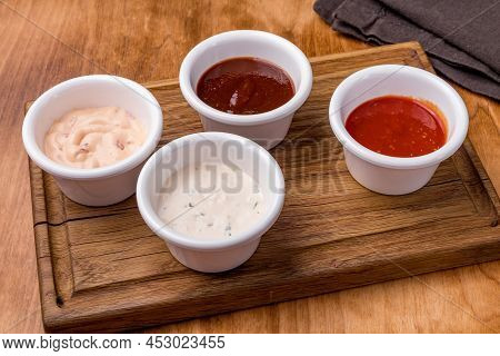 Assorted Sauces On The Board Side View