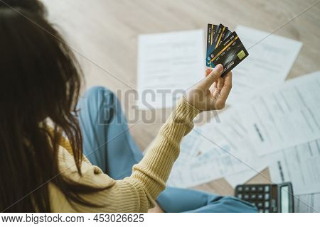 Top View Owe Asian Woman Sitting On Floor Stressed And Confused By Calculate Expense From Invoice, B