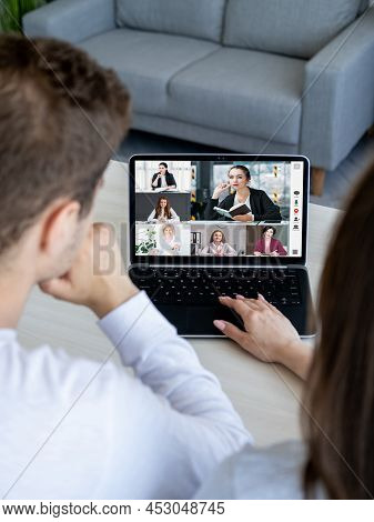 Online Interview. Group Video Chat. Wfh Teleconference. Couple Using Laptop Discussing Project With 