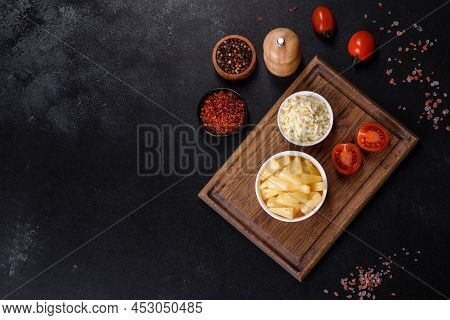 Canned Pineapple Chunks In A White Bowl On A Dark Concrete Background