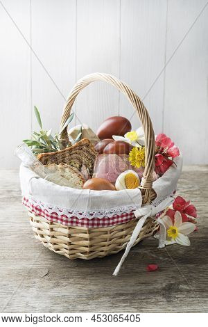Easter Traditional Food With Ham, Eggs And Bread In Basket. Holidays Background. Easter Basket Fille