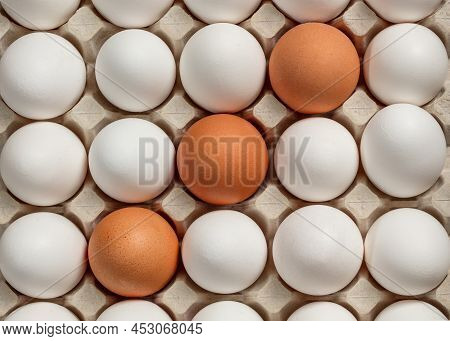 Chicken Eggs Brown And White In A Tray. View From Above.