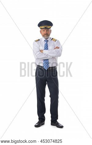 Senior Adult Airline First Pilot Aircraft Commander Standing With Arms Folded Isolated On White Back