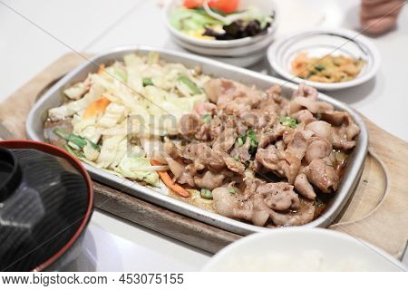 The Japanese Stir Fried Pork Served With Japanese Rice And Salad.