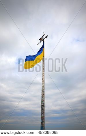 Ukrainian Flag Against The Background Of The Sky With Clouds