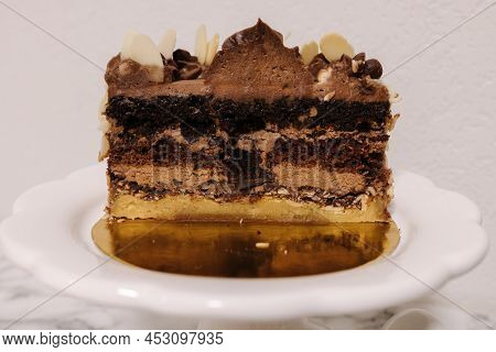 Close Up Of Hulf Of Chocolate Bento Cake. Presentation Cake On Easter Bunny Stand. Cake In Section