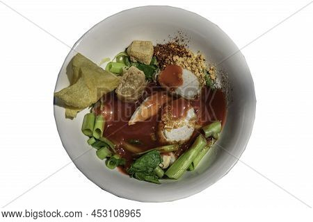 Traditional Yentafo Or Egg Noodles With Pink Sauce And Fish Balls, Fried Tofu, Chinese Morning Glory