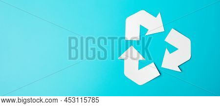 Paper Recycle Logo Cutout On Blue Background. Environmental Protection, Zero Waste, Reusable, Say No