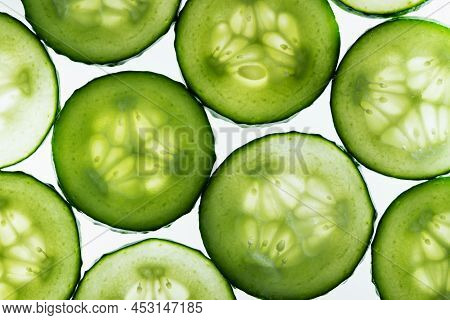 Background With Cucumbers. Close Up Of Fresh Cucumber Slices Top View Texture Background. Fresh Cucu