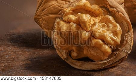Walnuts On A Wooden Table.  Walnut Fresh Nuts Background Top View