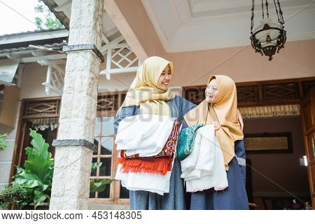 Asian Muslim With Hijab Standing In Front Of The House