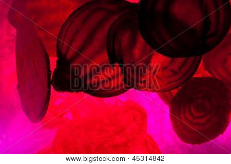 sliced raw beet in water. Close up