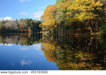 Vibrant Autumn Foliage Reflections On The Chippewa River In Brunet Island State Park, Central Wiscon