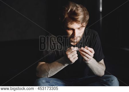 Junkie Man Holding Syringe For Drug Dose