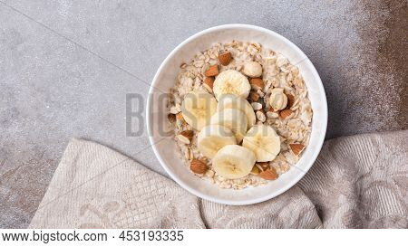Healthy Breakfast With Oatmeal, Nuts And Banana