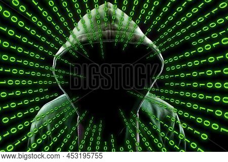 Hacker Over A Screen With Binary Code.