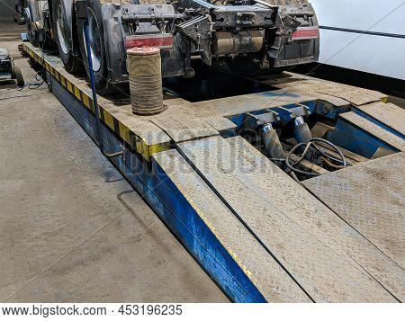A Hydraulic Platform For Lift Cargo Truck. Planned Maintenance Of Cars.