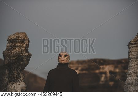 Portrait Of Alien Head In A Dark Outdoors Nature Background. Concept Of Aliens Among Us. Extraterres