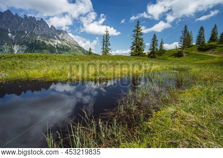 Mountain Pond With Wilder Kaiser Range Reflecting In Water Pond, Tirol - Austria