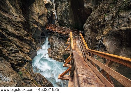 Wooden Hike Trail Path Inside A Gorge With Bue Mountain River, Sigmund Thun Klamm, Kaprun, Austria