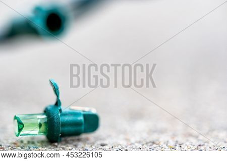 Focus On Replacement Bulb For A String Of Christmas Lights To Repair A Dud.