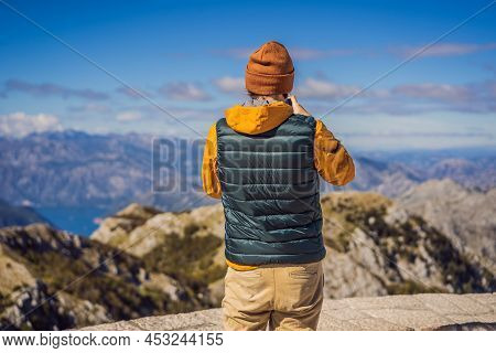 Man Traveller In Mountain Landscape At National Park Lovcen, Montenegro. Travel To Montenegro Concep