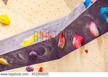 Stone Hook On The Artificial Climbing Wall In Bouldering Gym.