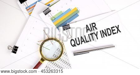Aqi Abbreviation Of Air Quality Index Text On A White Paper On The Light Background With Charts Pape