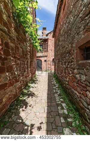 Narrowest Cobblestone Back Street Of  Collonges-la-rouge Squeezed Between 2 Masonry Walls. Correze D