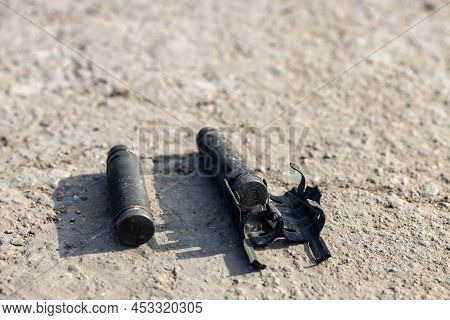 Unexploded Ordinance (shell, Missile) With Belt After Invasion On The Ground After Battle In The Vil