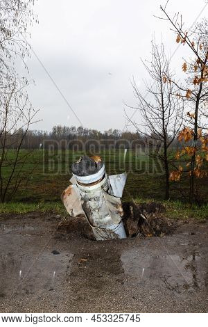 Hostomil Reg, Ukraine - Apr. 22, 2022: An Unexploded Rocket Of The Russian Occupying Troops Sticks O
