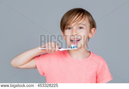 Boy Toothbrush White Toothpaste. Health Care, Dental Hygiene. Joyful Child Shows Toothbrushes. Littl