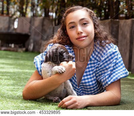 Beautiful Young Girl Having Fun With Her Small French Braque Puppies