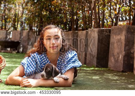 Beautiful Young Girl Having Fun With Her Small French Braque Puppies