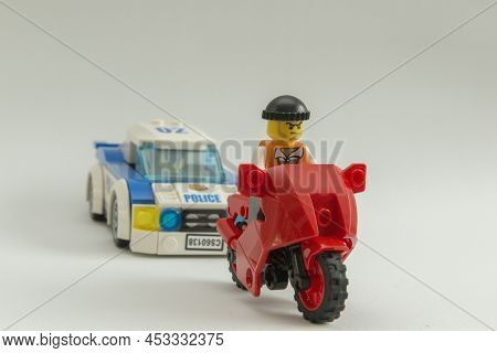 Bauru, Brazil. September 15, 2019. Minifigure Of A Thief Riding A Motorcycle Being Chased By A Polic