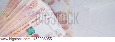 Russian Rubles On A White Background. Currency Exchange. Financial Crisis, Ruble Devaluation Concept