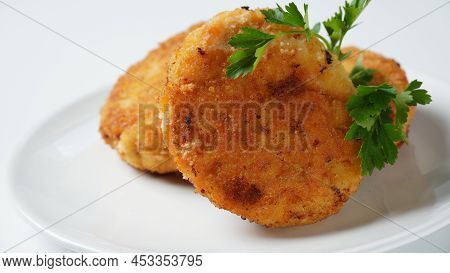 Plate With Chicken Cutlets. Fried Juicy  Cutlets On A White Plate Garnished With Parsley