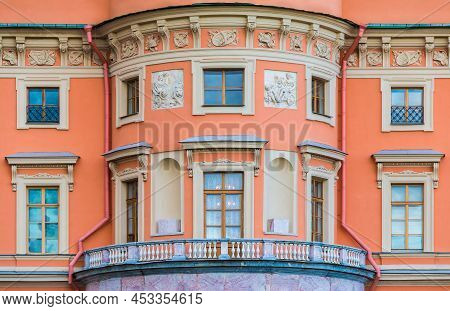 Balcony And Many Windows In A Row On The Facade Of The Urban Historic Apartment Building Front View,