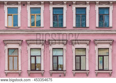 Many Windows In A Row On The Facade Of The Urban Historic Apartment Building Front View, Saint Peter