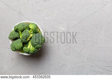 Broccoli Of Fresh Green Broccoli In Bowl Over Coloredbackground. , Close Up. Fresh Vegetable.
