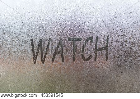 Foggy Glass On Window With Written Finger Word Watch