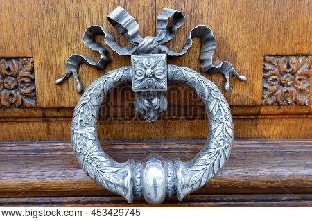 European Vintage Old Metal Wrought Iron Door Knocker. Design Detail. Paris.