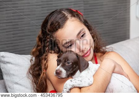 Beautiful Young Girl Dressed In Red With Her Small French Braque Puppy