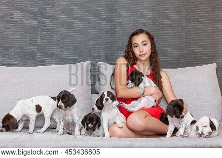 Beautiful Young Girl Dressed In Red With Her Small French Braque Puppy