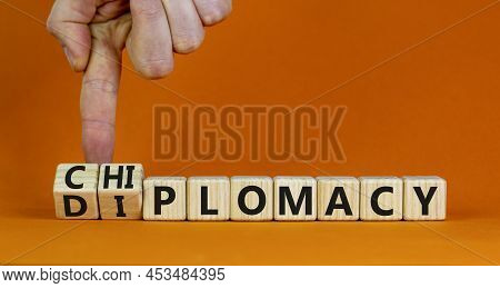 Diplomacy Or Chiplomacy Symbol. Businessman Turns Cubes And Changes The Concept Word Diplomacy To Ch
