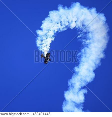 Buckeye, Arizona, Usa - February 19, 2022: A Bi-plane Performing Aerobatics At The Buckeye Air Show 