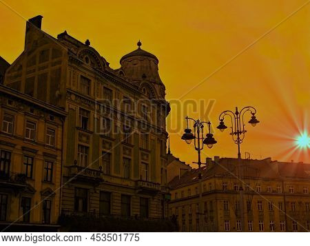 Lviv In Ukraine - Old Town With Historic Tenements At Sunset .