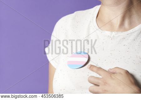 Unrecognizable Person Wearing And Pointing A Trans Flag Badge Or Pin. Concepts Of Identity Pride, Ge